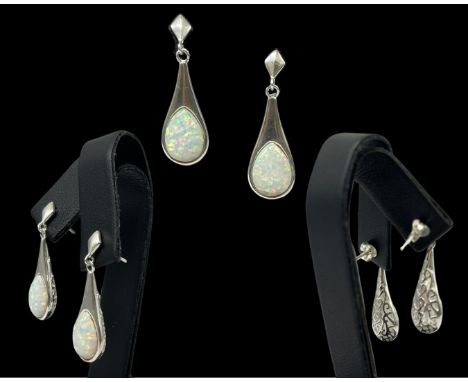 A pair of silver and pear shaped opal drop earrings, weighing 4.20 grams