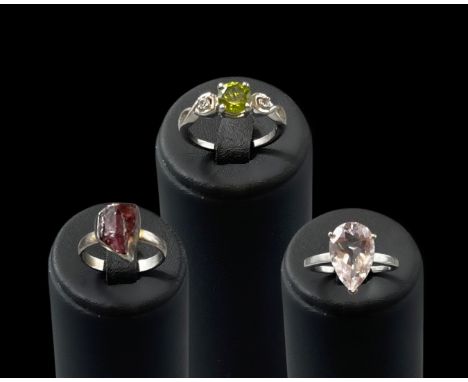 Selection of Silver 925 rings to include, a 3.8ct pear cut light purple stone set ring size P 1/2, 3 stone ring featuring Per