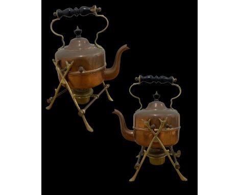 Antique copper and brass kettle on stand