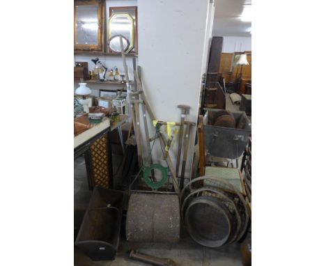 A garden lawn roller and garden tools 