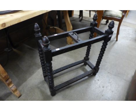 A carved oak stick stand 