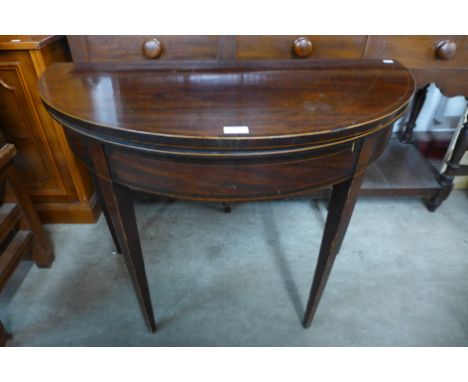 A George III inlaid mahogany demi-lune fold over card table, 74cms h x 92cms w 