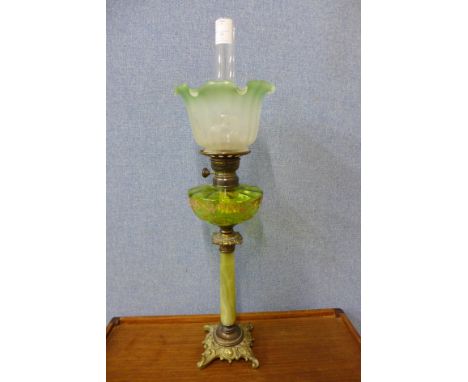 A Victorian Matador Brenner onyx and gilt metal oil lamp, with green glass reservoir, 76cms h 