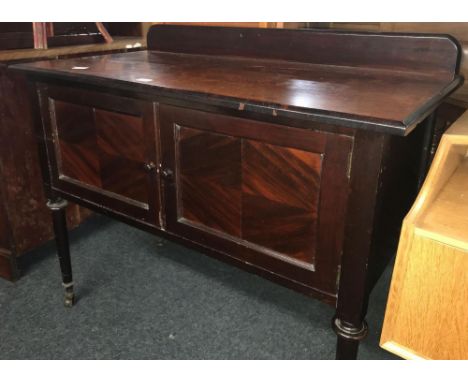 MAHOGANY 2 DOOR CUPBOARD ON PILLAR LEGS WITH CASTERS