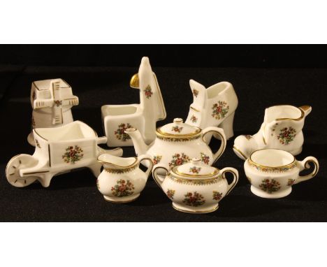 A Coalport miniature teapot, milk jug and sugar bowl, 5cm high; other Coalport miniatures, wheelbarrow, shoes, etc (9) 