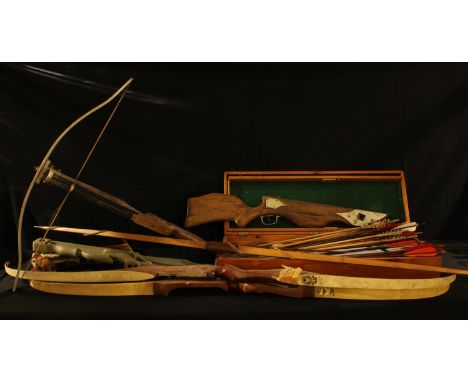 Archery - a Marksman recurve bow; another similar; a long bow; an Allen Sinclair crossbow; other crossbow parts; a selection 