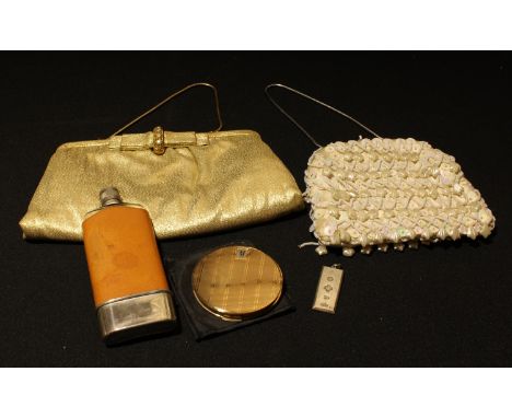 A silver pendant ingot, Birmingham 2000, 32g; two evening purses; a Stratton powder compact with soft cover; a hip flask 