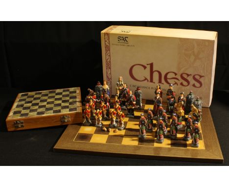 A Battle of Culloden Chess Set by Studio Anne Carlton, boxed; another chess set; a chess board 