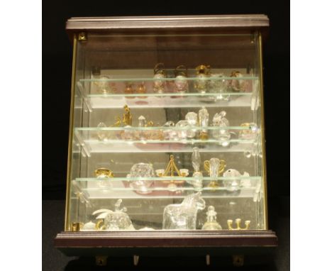 A miniature glazed wall hanging display cabinet, 28.5cm x 25cm, a collection of assorted crystal miniatures, mouse, kettle, t