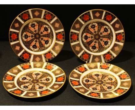 A Royal Crown Derby 1128 pattern tea plate, 16cm diameter, printed marks in red, first quality; three others, second quality 