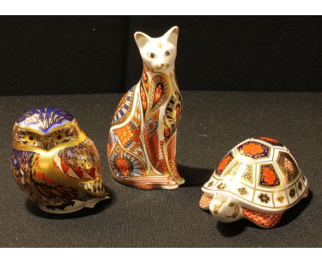A Royal Crown Derby paperweight, Siamese Cat, gold stopper, first quality; others, Owl, gold stopper, first quality; Tortoise