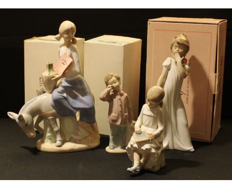 A Nao Spanish porcelain figure, Girl Yawning 00230, boxed; others, La Parvulita 00117, boxed; Bedtime Bear, boxed; a Casades 