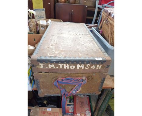 A metal bound trunk "J.M.Thompson" with contents of photo albums and picture postcards.