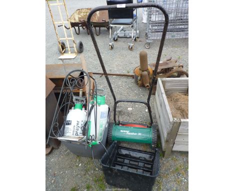 A "Qualcast" push mower and garden sprayer and miscellaneous tools.
