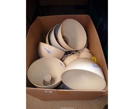 A quantity of metal ceiling light shades.