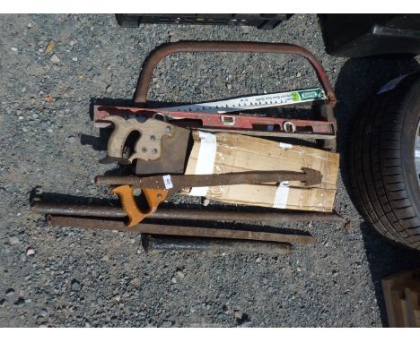A Thatcher's tool, bow saw, sledge hammer, spirit level, iron bars.