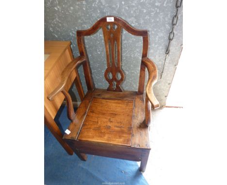 An oak commode chair.