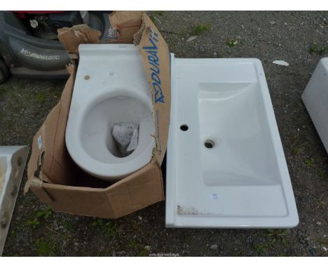 A "Duravit" toilet and a large hand basin.