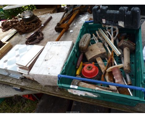 A quantity of various tiles and various tools, mallets, etc.