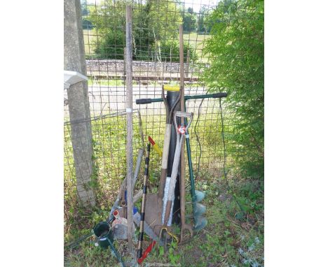A quantity of garden tools to include shears, forks, spades, etc.