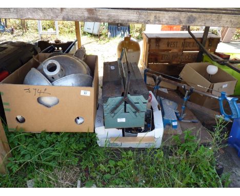 A table top saw plus cantilever tool box and contents to include: nuts, bolts and a quantity of light shades.