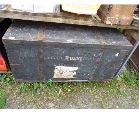 A large wooden military trunk/chest.
