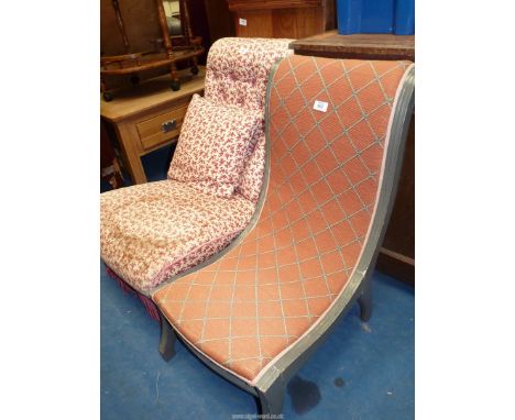 A tapestry seated low chair with grey painted frame.