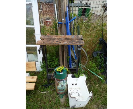 A number of gardening tools, Workmate and "Ronseal" fence spray equipment.