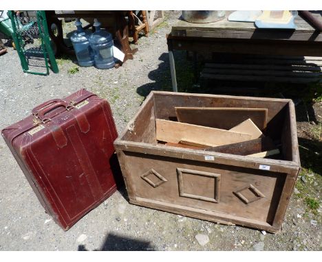 A wooden trunk, a/f and a suitcase.