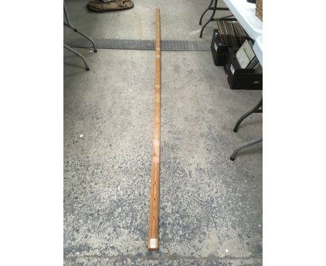 A WOODEN THREE METRE MEASURING STICK 