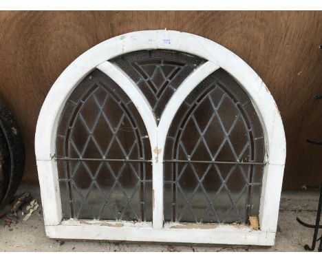 A VINTAGE ARCH SHAPED STAIN GLASS WINDOW 