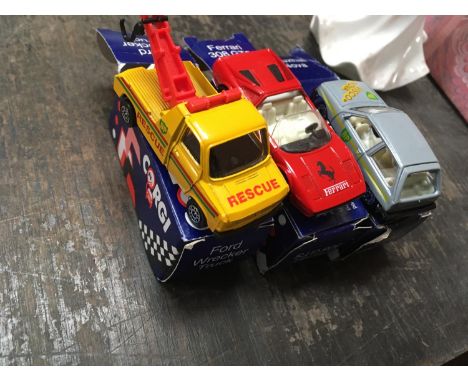 THREE BOXED CORGI CARS TO INCLUDE A FORD TRUCK, FERRARI AND A VAUXHALL NOVA 