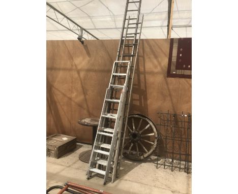 AN EIGHT RUNG ALLOY STEP LADDER, AND ELEVEN RUNG TWO SECTION ALLOY LADDER AND A TWELEV RUNG LADDER 
