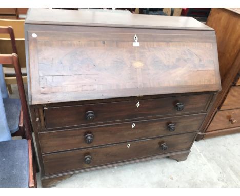 A LARGE INLAID MAHOGANY BUREAU ON BRACKET FEET WITH FALL FRONT AND THREE DRAWERS HAVING BONE ESCUTCHEONS 