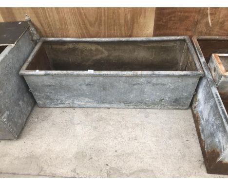 A VINTAGE GALVANISED WATER TROUGH APPROX 4FT LONG 