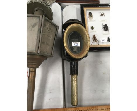A BLACK AND BRASS COACH LAMP 