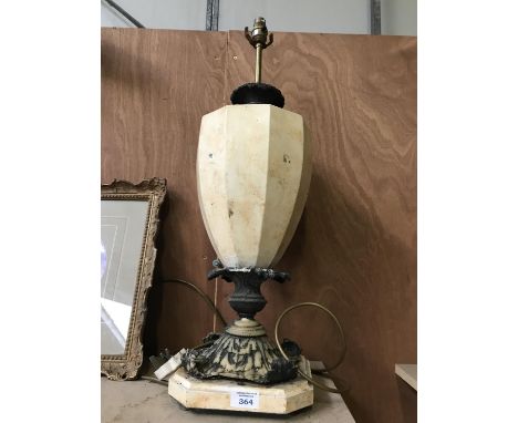 A LARGE CREAM AND BLACK ORNATE TABLE LAMP 