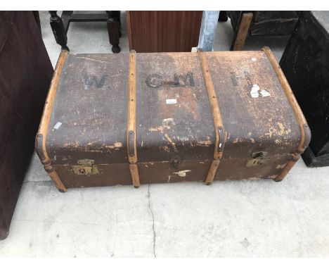 A VINTAGE WOODEN BOUND TRAVEL TRUNK 