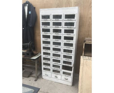 A VINTAGE SHOP CABINET WITH THIRTY THREE DRAWERS 91CM X 52.5CM X 198CM HIGH (ONE DRAWER MISSING) 