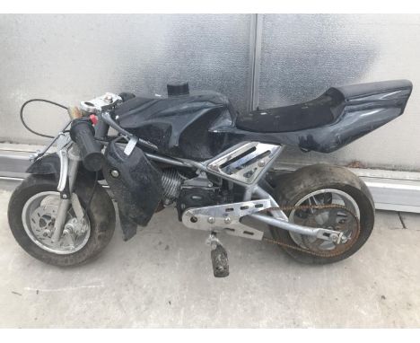 A BLACK MINI MOTO BIKE PETROL PULL START ENGINE 