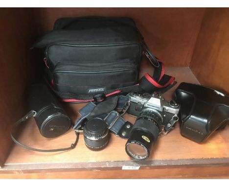 AN OLYMPUS CM10 CAMERA WITH LENS AND BAG 