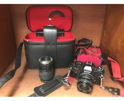 A RICOH KR10 CAMERA, LENS AND BAG 