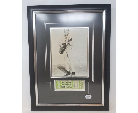 An Elvis Presley presentation, featuring a photograph of Elvis playing the guitar, and a concert ticket for Hulman Civic Univ