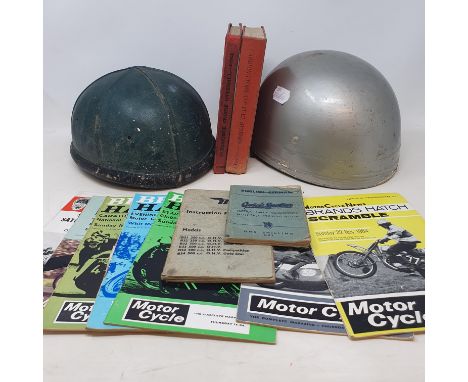 A Cromwell ACU approved pudding basin helmet, another similar, and various motorcycle racing meet programmes from the 1960's 