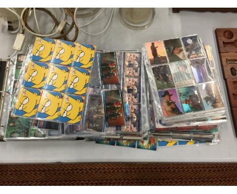 A LARGE COLLECTION OF ASSORTED TRADING CARDS FROM TV AND FILM FAVOURITES TO INCLUDE, LORD OF THE RINGS, THE SIMPSONS, BUFFY, 