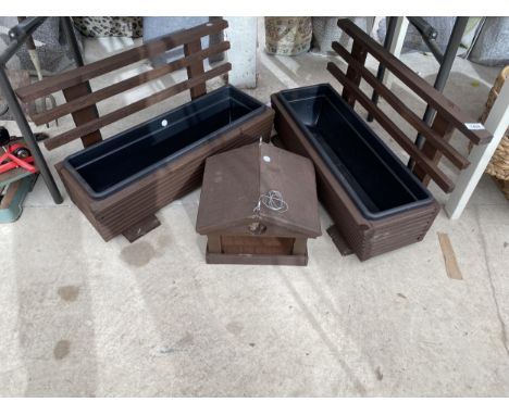 TWO WOODEN TROUGH PLANTERS AND A WOODEN BIRD TABLE TOP 