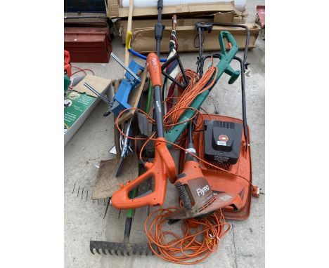 AN ASSORTMENT OF GARDEN TOOLS TO INCLUDE A FLYMO, GRASS STRIMMERS AND SPADES ETC 