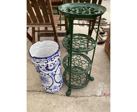 A BLUE AND WHITE CERAMIC STICK STAND AND A  WROUGHT IRON 'THE VIKING' PAN STAND 