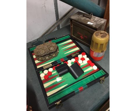 FOUR ITEMS TO INCLUDE A VINTAGE FIRST AID BOX, ANTI FROST HEATER, BACKGAMMON SET AND A BEADED BOX 