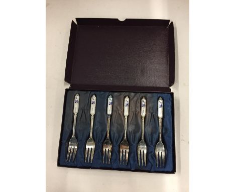 A BOXED SET OF SIX PLATED CAKE FORKS WITH DECORATIVE CERAMIC HANDLES 